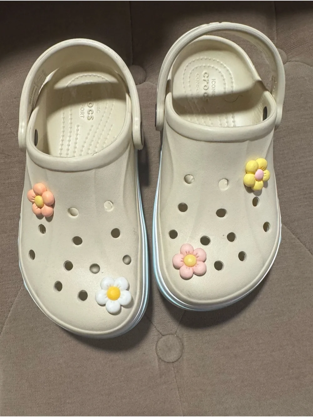 CROCS Kids Cream Clogs with Pink Yellow and White Flower Charms